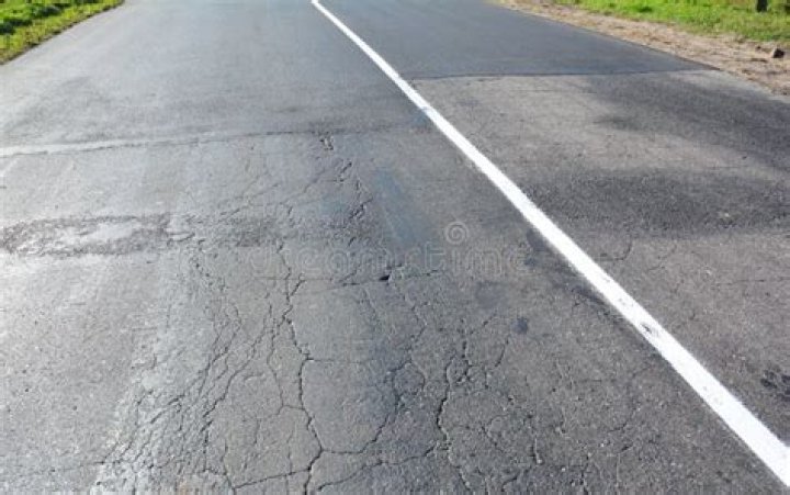 Do heavy trucks damage roads?